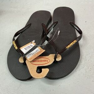 NWT Havaianas Slim Black/Golden Flip Flops w/Metallic Pop-Up Logo on Strap 11-12